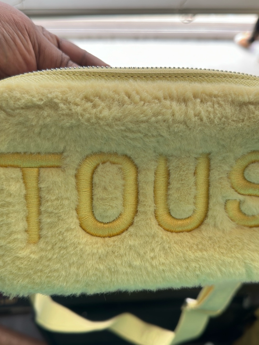 This is a yellow TOUS Cloud Warm faux fur crossbody bag.